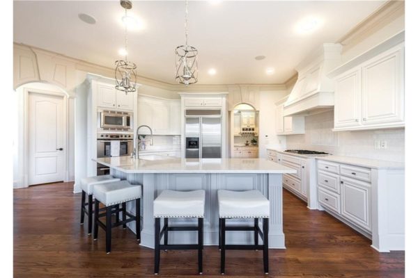 Beautiful kitchen renovation with newly painted white cabinets