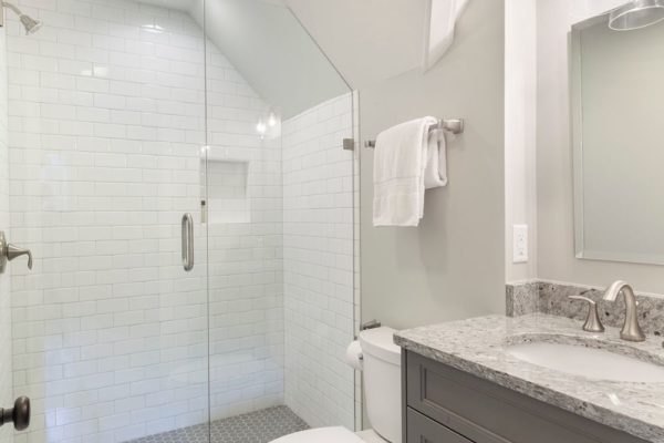 Complete bathroom with walk in shower.