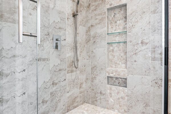 Remodeled shower with rain head, and handheld faucet.