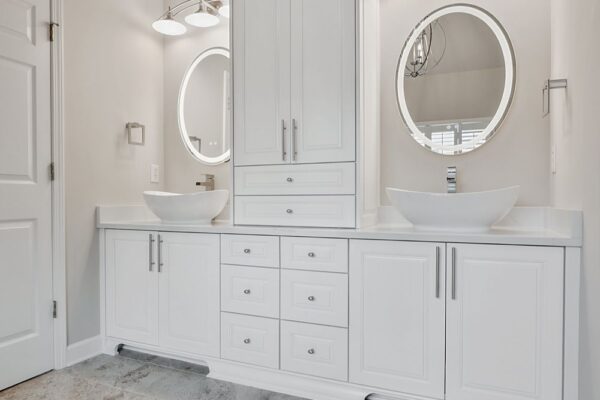 Custom vanity cabinets with plenty of drawer space.