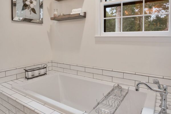 Floating shelves, and natural light in this master bath remodel.
