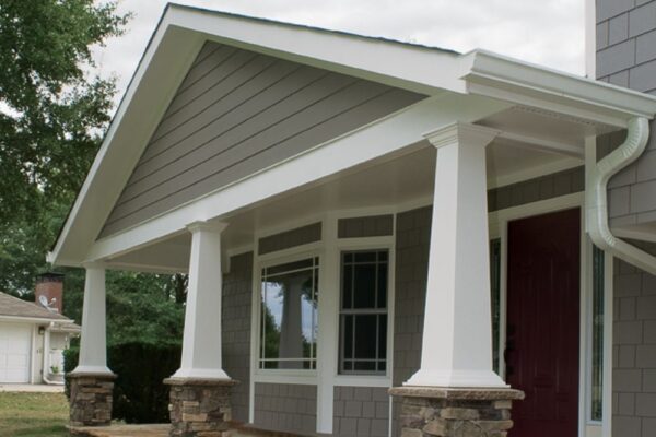 Tapered wood columns with stone bases on this new covered front porch.