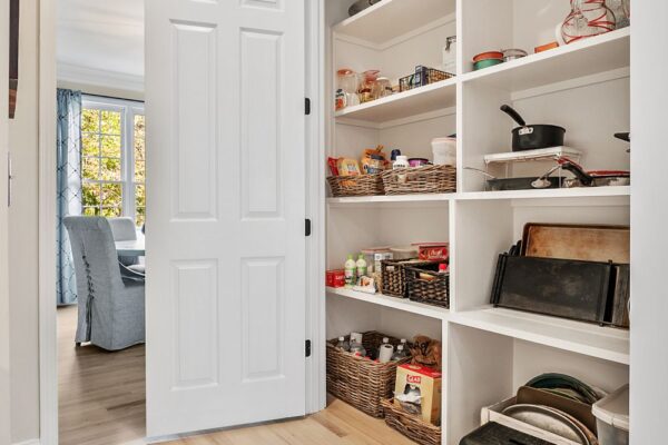 Reach in pantry with custom shelving.